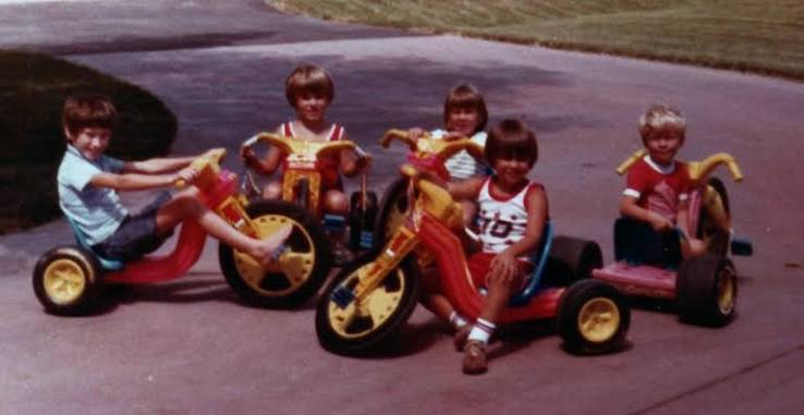 1980s Big Wheel ride-on toys on a driveway