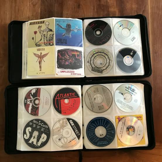 90s CD binder and grunge music memory image