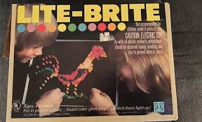 1970s Lite-Brite toy with colored pegs