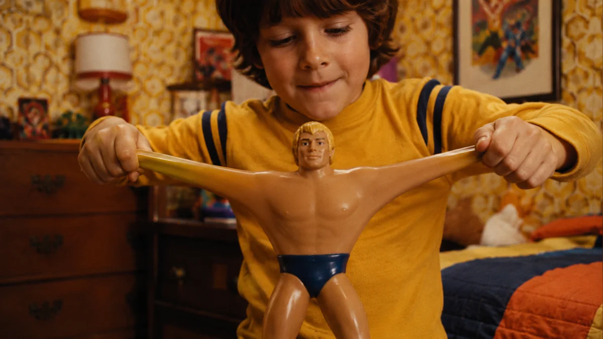 Children stretching a Stretch Armstrong toy on Christmas morning in 1976