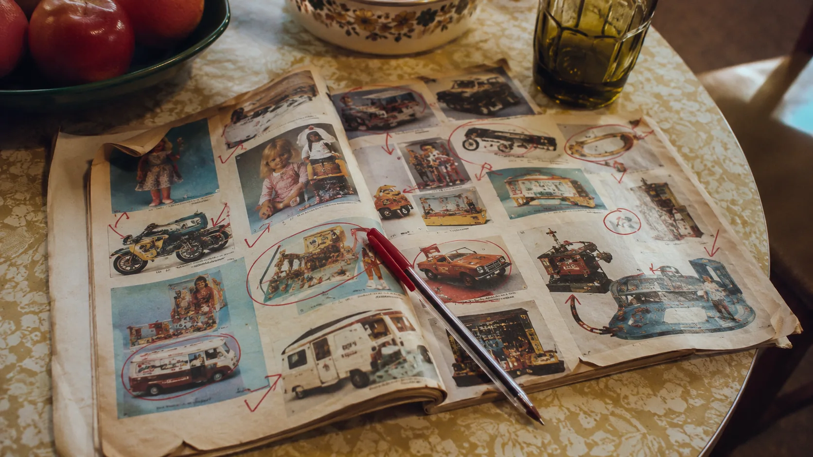 A worn 1970s toy catalog covered with red circles, arrows and folded page corners