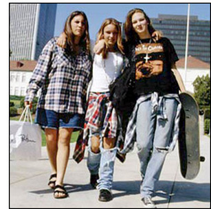 90s alternative rock women's fashion with combat boots thrift-store layers dark lipstick baby-doll dresses and grunge style