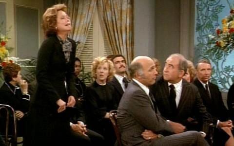 Mary Richards trying not to laugh during the funeral in Chuckles Bites the Dust