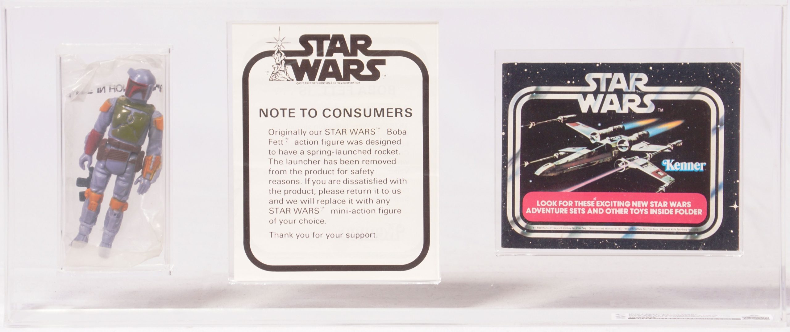 Close view of an early armored bounty-hunter action figure and its rocket-backpack feature