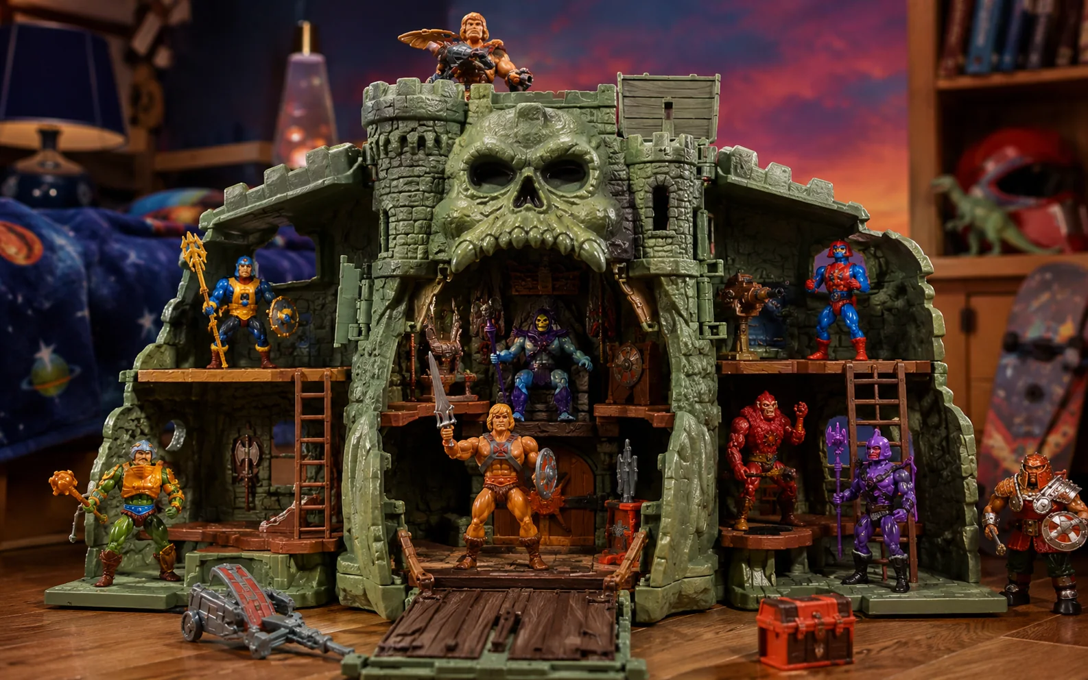 Large green skull-faced castle playset opened on a bedroom floor with fantasy figures stationed inside and around it.