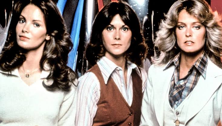 Charlie’s Angels cast modeling the fashion and glamour associated with the original series