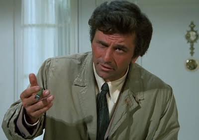 Lieutenant Columbo studying a case while questioning a suspect