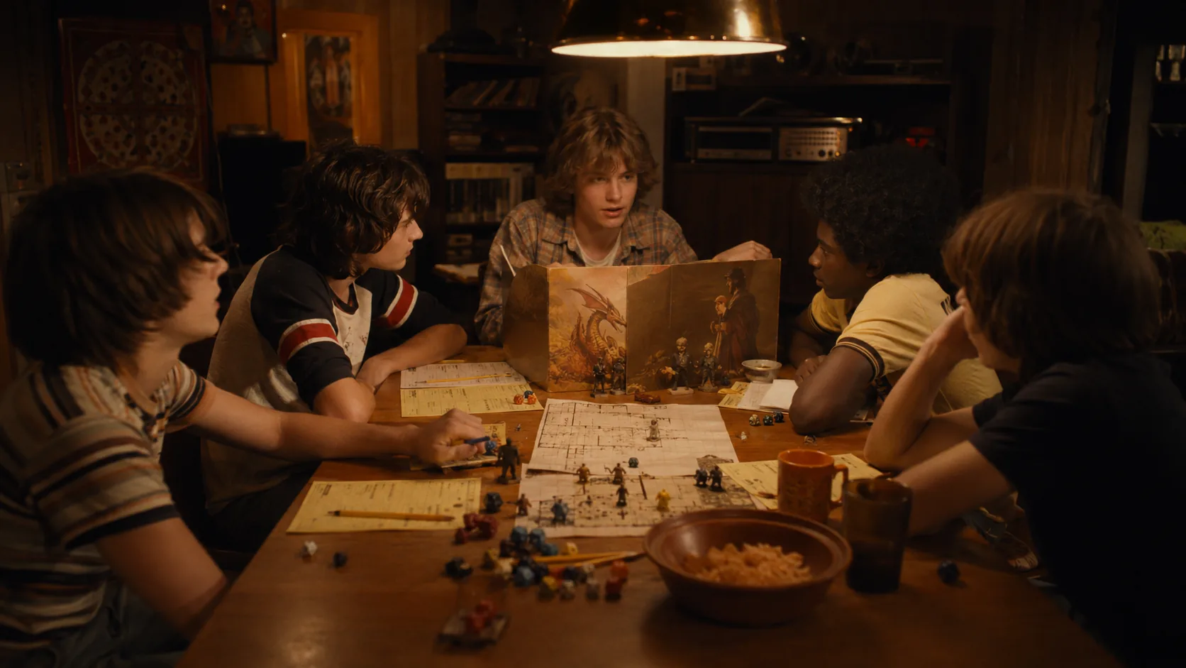 Friends gathered around a table for a 1970s fantasy role-playing game night