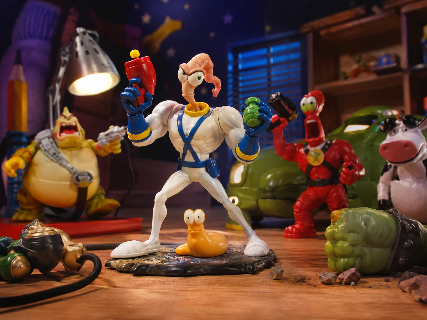 Cartoonish worm superhero action figure surrounded by strange 1990s toy villains