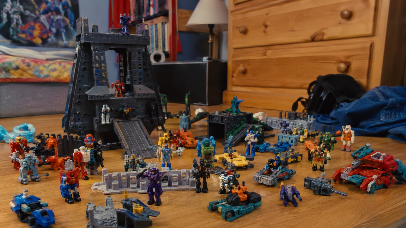 Tiny robot armies staged on a 1990s bedroom-floor battlefield