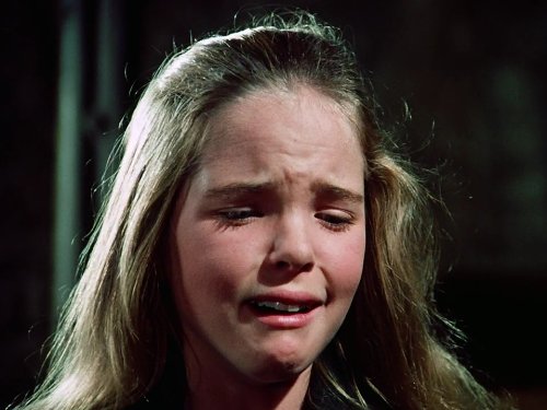 Laura Ingalls in an emotional scene from Little House on the Prairie