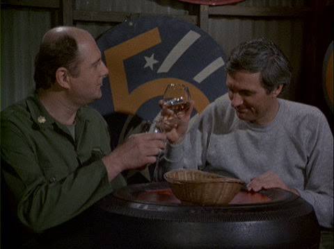 Charles Winchester and Hawkeye Pierce facing each other in M*A*S*H