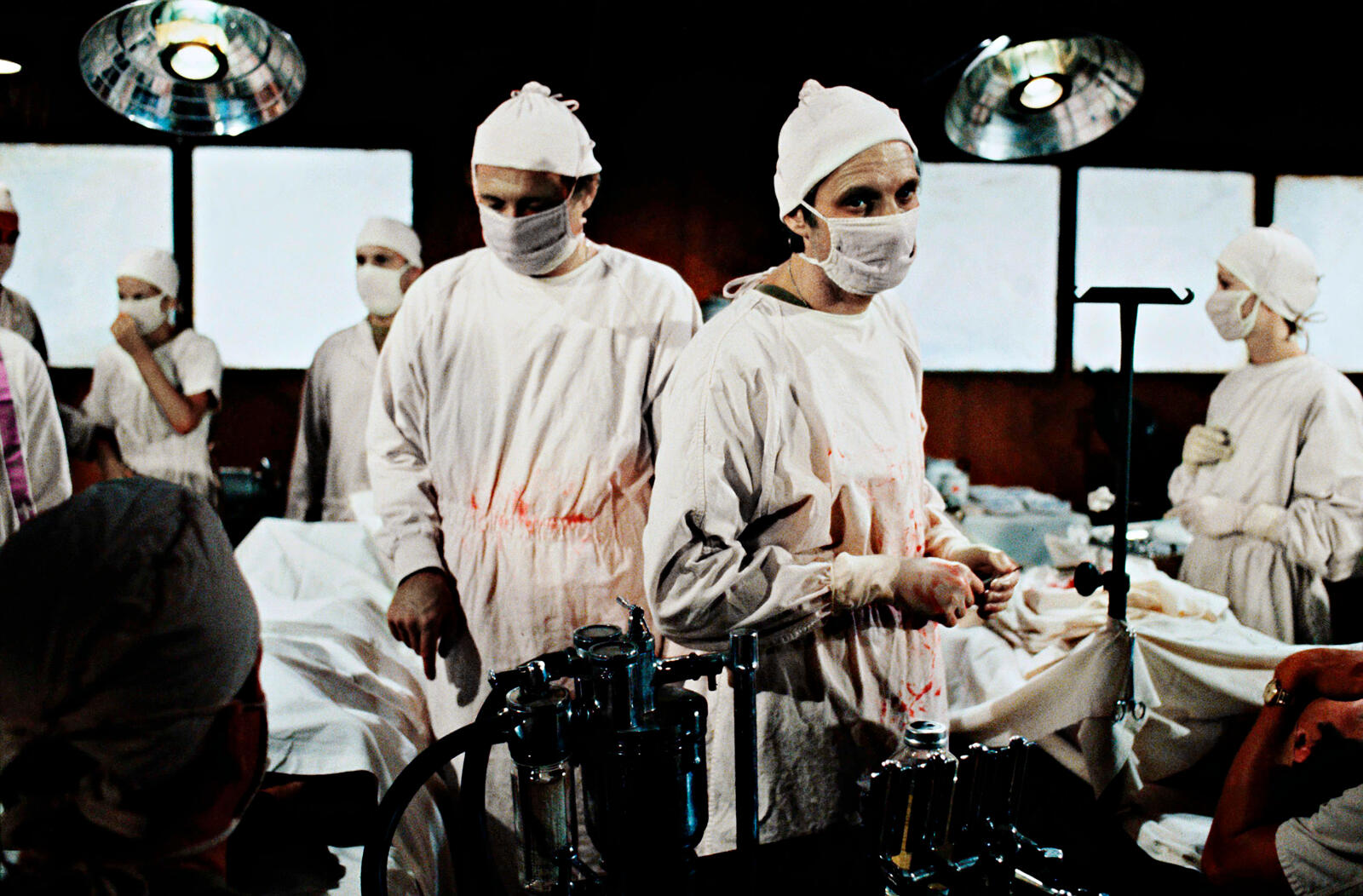 Hawkeye Pierce, Margaret Houlihan and the 4077th medical staff performing surgery in the M*A*S*H operating room