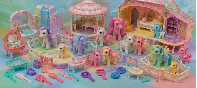 Wide pastel playroom filled with pony playsets, nurseries, stable pieces, waterfalls, fences, furniture, combs, ribbons, and several ponies.