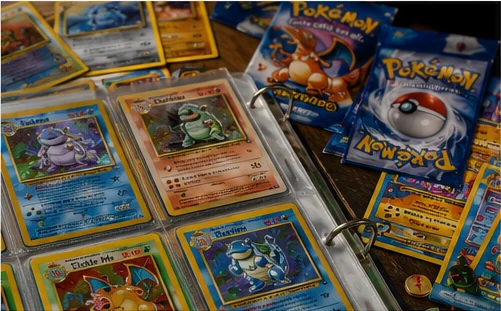 Pokémon trading cards, binder pages and booster packs from the late 1990s