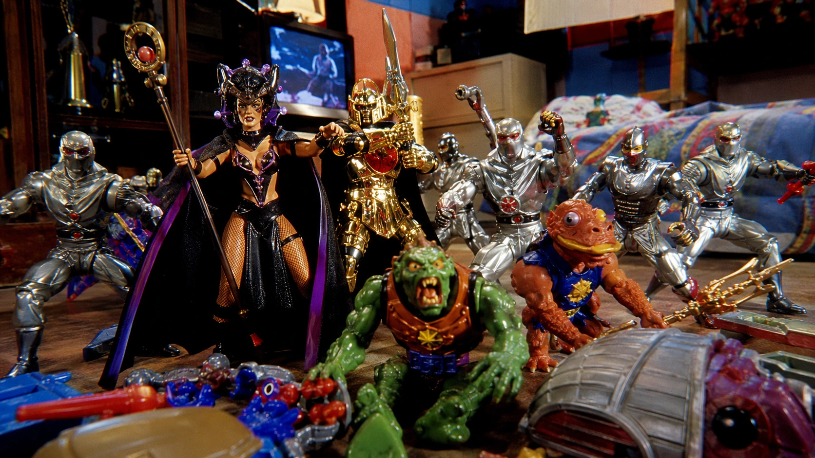 Power Rangers villain, gold-armored warrior, silver Putty soldiers and monster figures arranged in a 1990s playroom battle