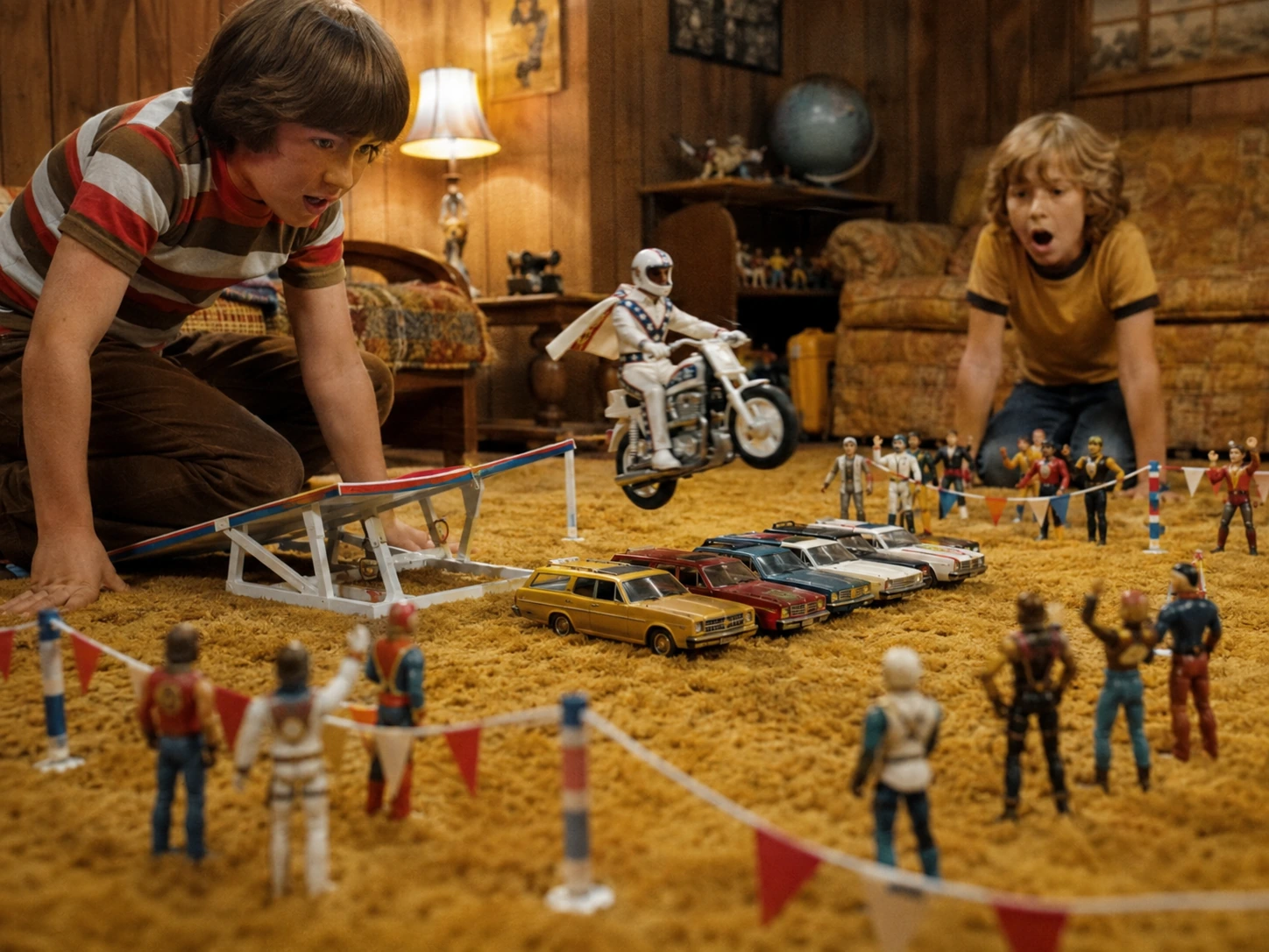 Children staging a complete Evel Knievel toy stunt show with spectators, cars and handmade barriers