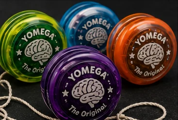 Colorful Yomega Brain yo-yos with strings from the late 1990s