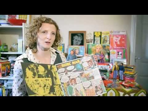 Adult collector displaying preserved Saturday morning cartoon memorabilia