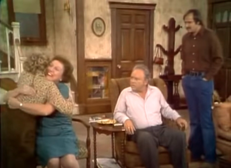 Archie, Edith, Mike and Gloria together in the Bunker family living room.