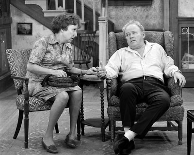Archie and Edith Bunker together in their living room