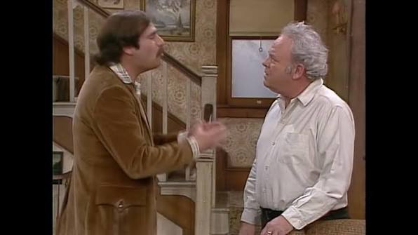 Archie Bunker and Mike Stivic arguing face-to-face