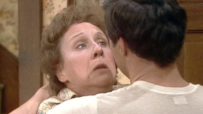 Edith Bunker resisting the attacker in Edith's 50th Birthday