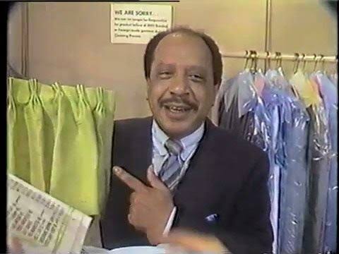George Jefferson inside one of his dry-cleaning stores