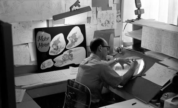 Artists working at desks on the Hanna-Barbera animation production floor