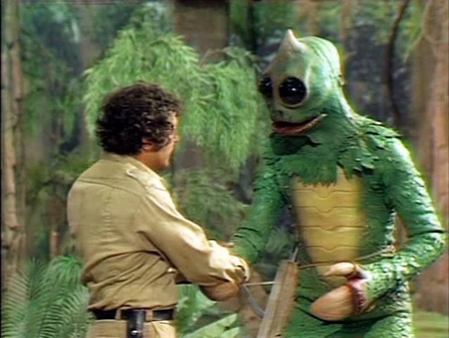 Land of the Lost cast with a Sleestak or dinosaur set