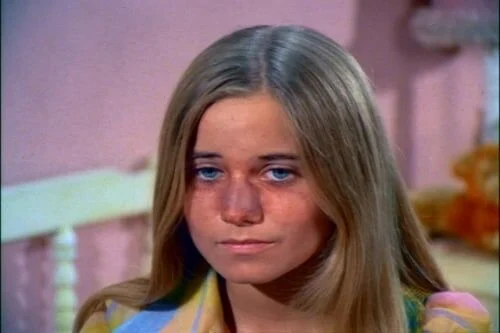 Marcia Brady after the football hits her nose