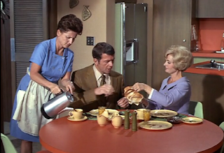 Mike Brady, Carol Brady and Alice together inside the Brady house