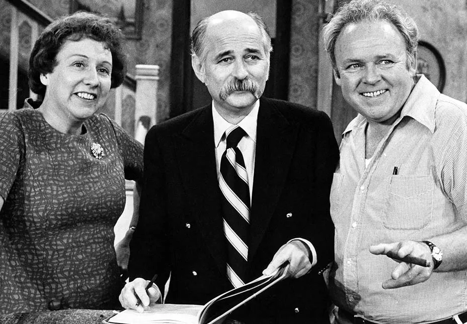 Norman Lear with members of a television cast during his years as a producer.