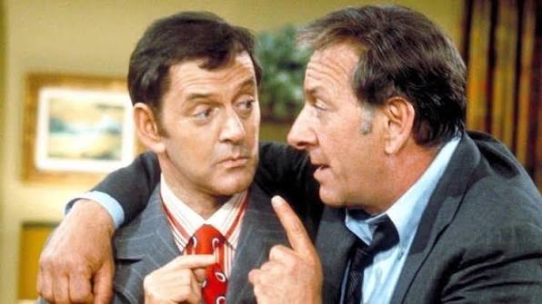 Oscar Madison and Felix Unger together in their apartment