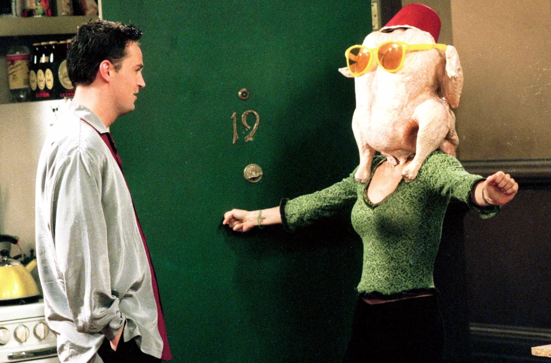 Monica with a turkey on her head in a Friends Thanksgiving episode