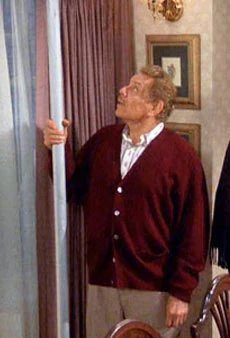 Frank Costanza holding the Festivus aluminum pole on Seinfeld