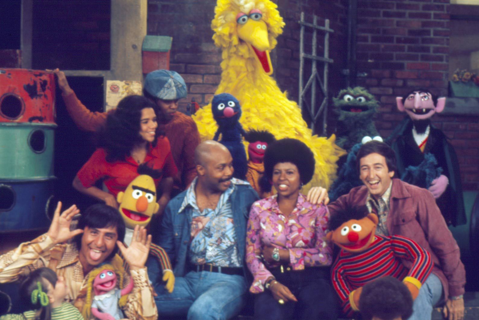 The 1970s Sesame Street cast gathered on the neighborhood set