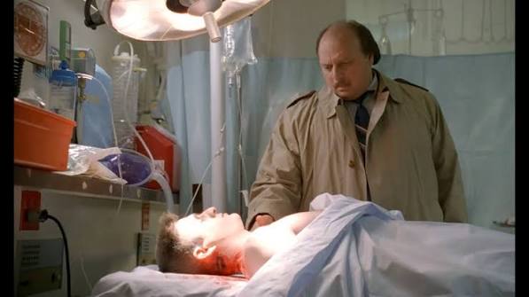 A Death in the Family episode still from NYPD Blue