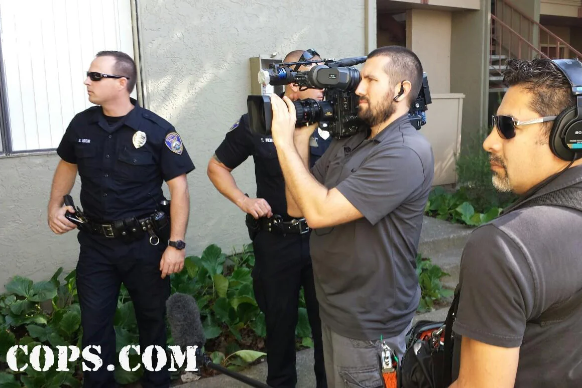 Cops camera crew on location