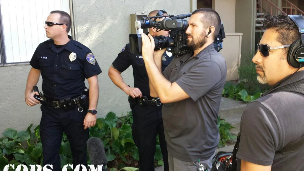 Cops production crew in patrol vehicle